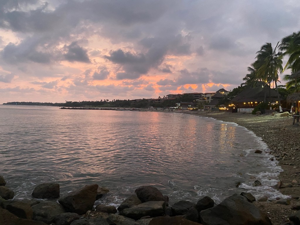 Beach shore at night outside an Inspirato luxury home in Punta de Mita, Mexico.